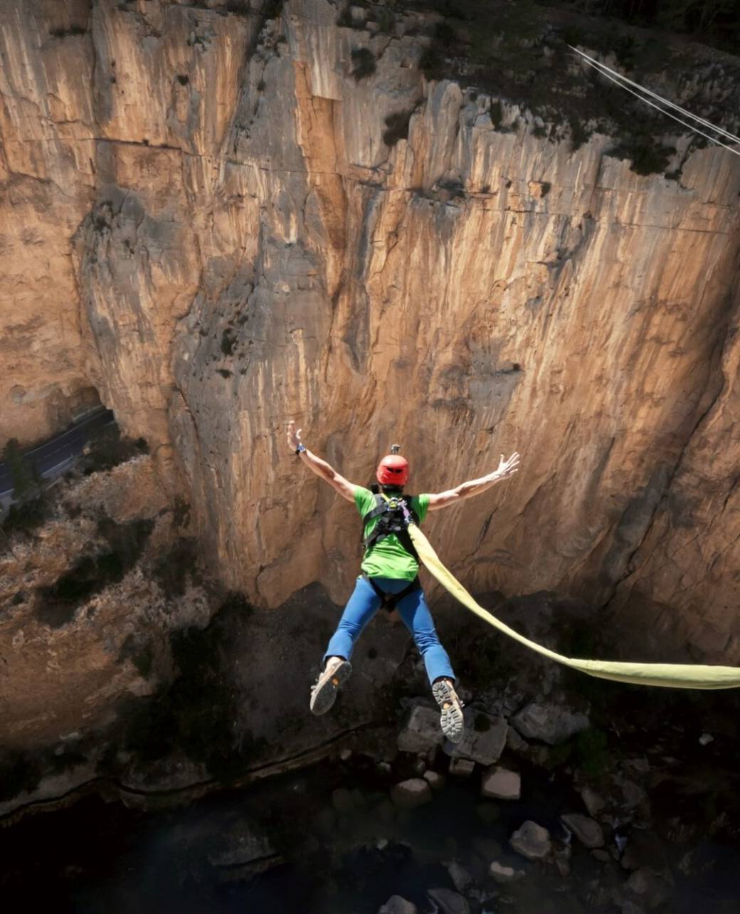 man bungee jumping in the mountain nature and adrenaline