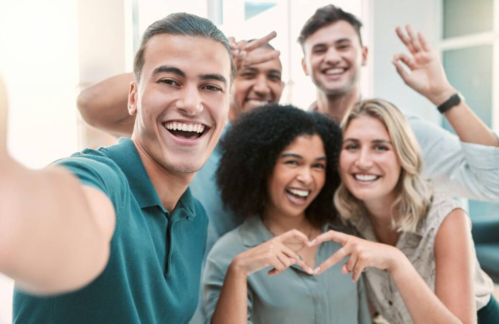 Happy, selfie and corporate team bonding in office at a meeting or team building together. Diversit